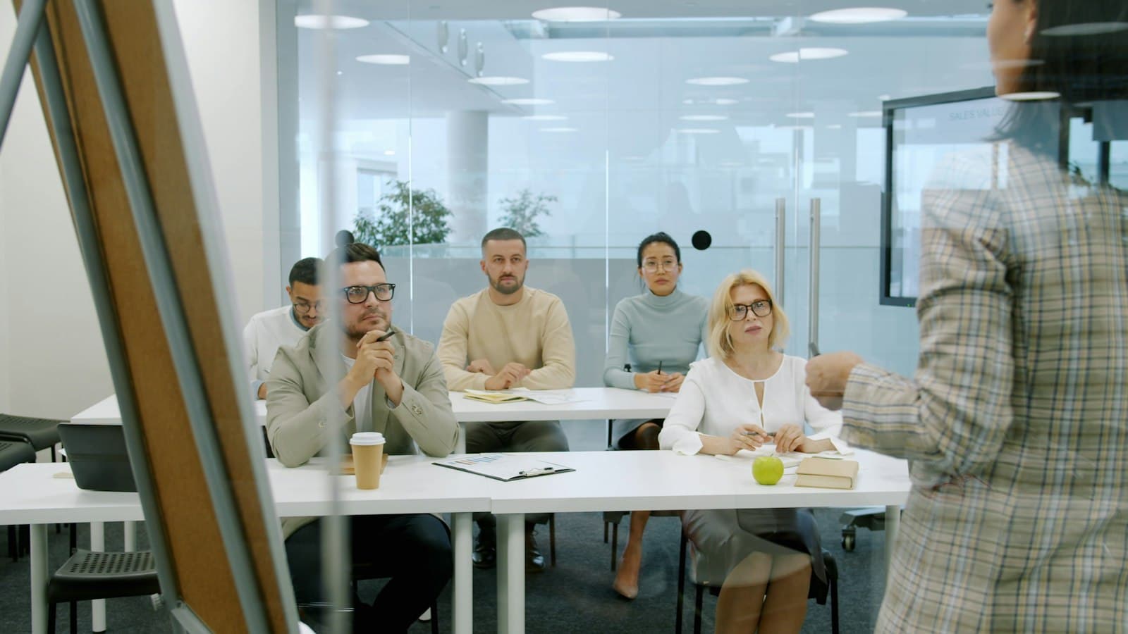 People listening to a presentation in a meeting room