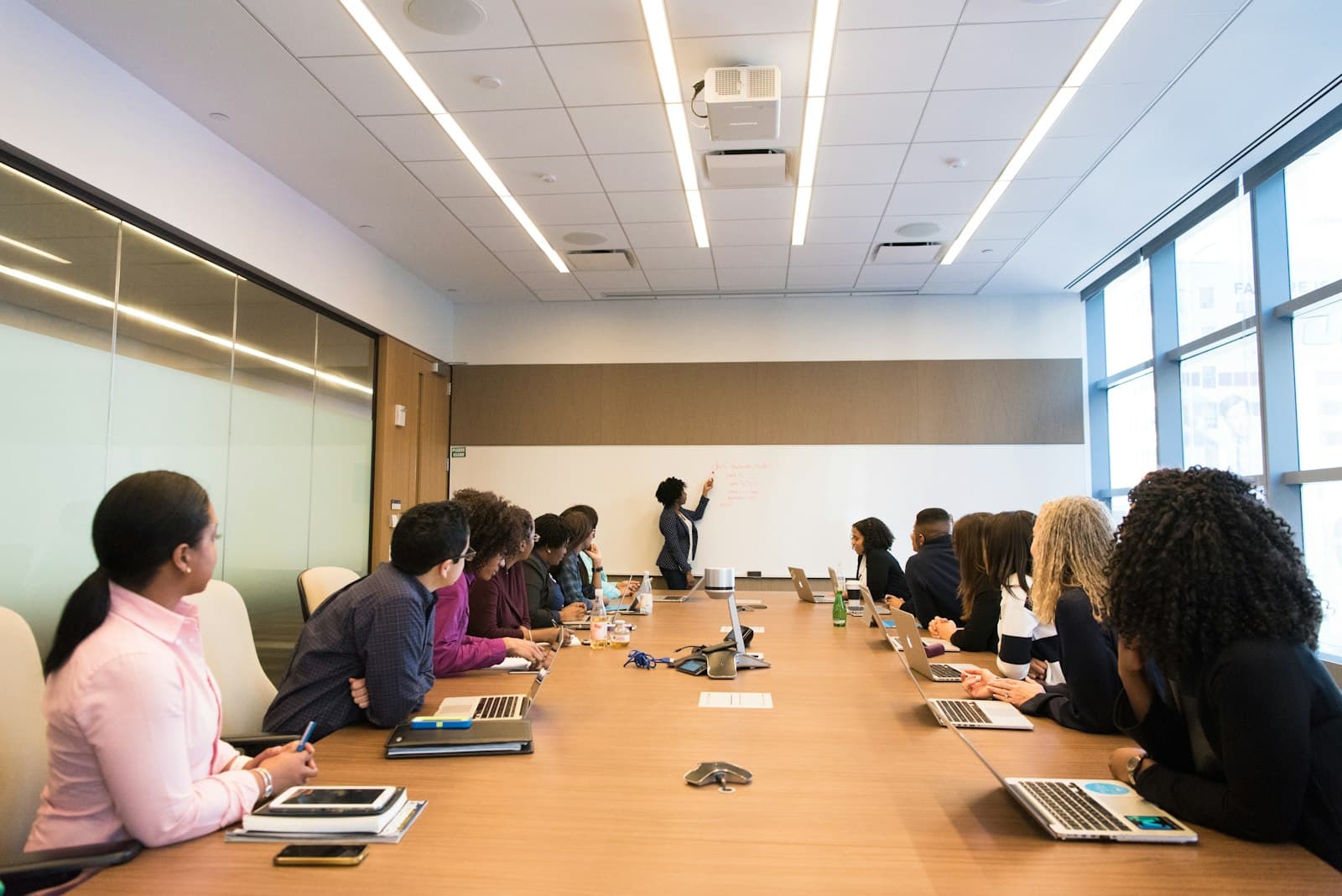 People gathered around a conference table for a presentation